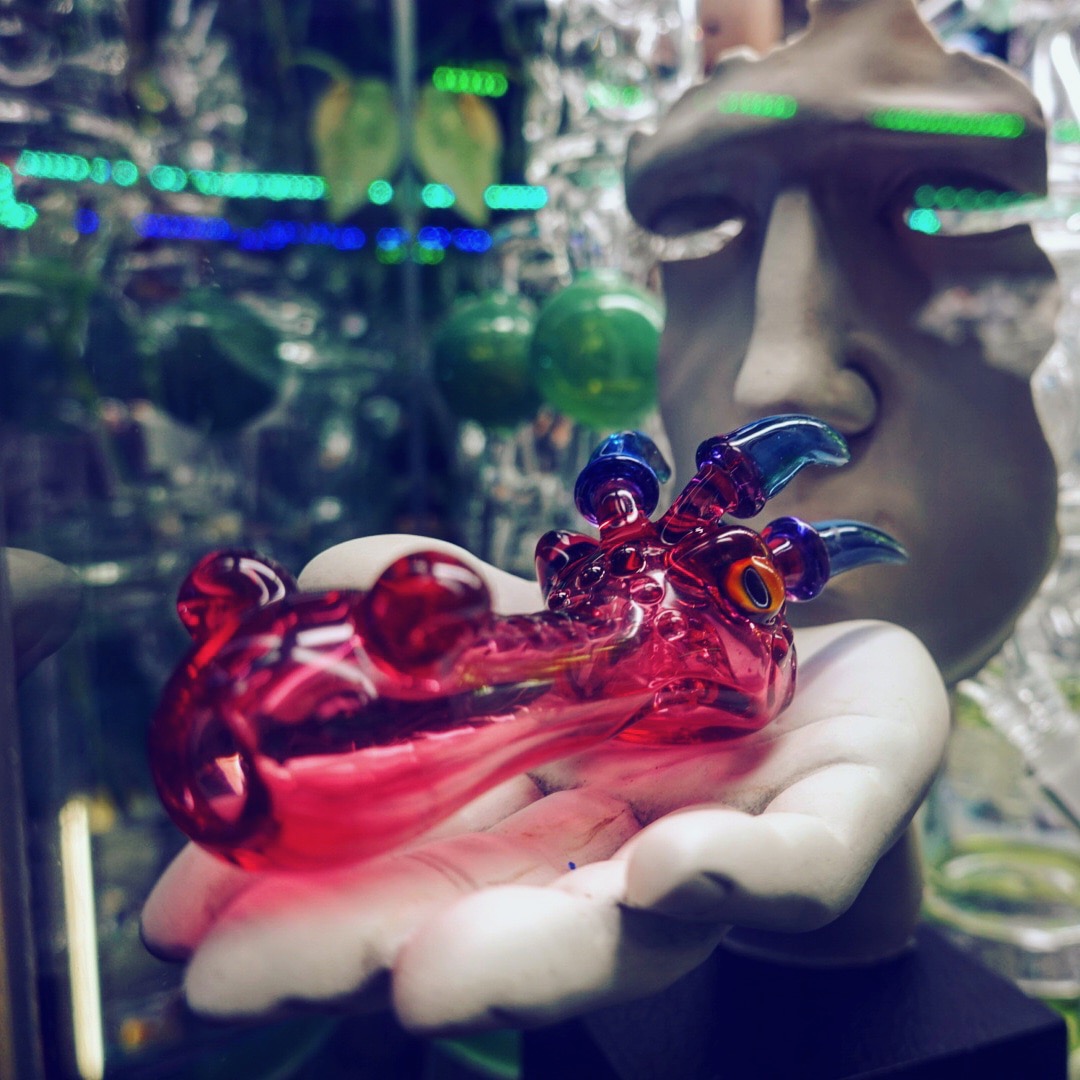 Glass pipe in shape of red dragon
